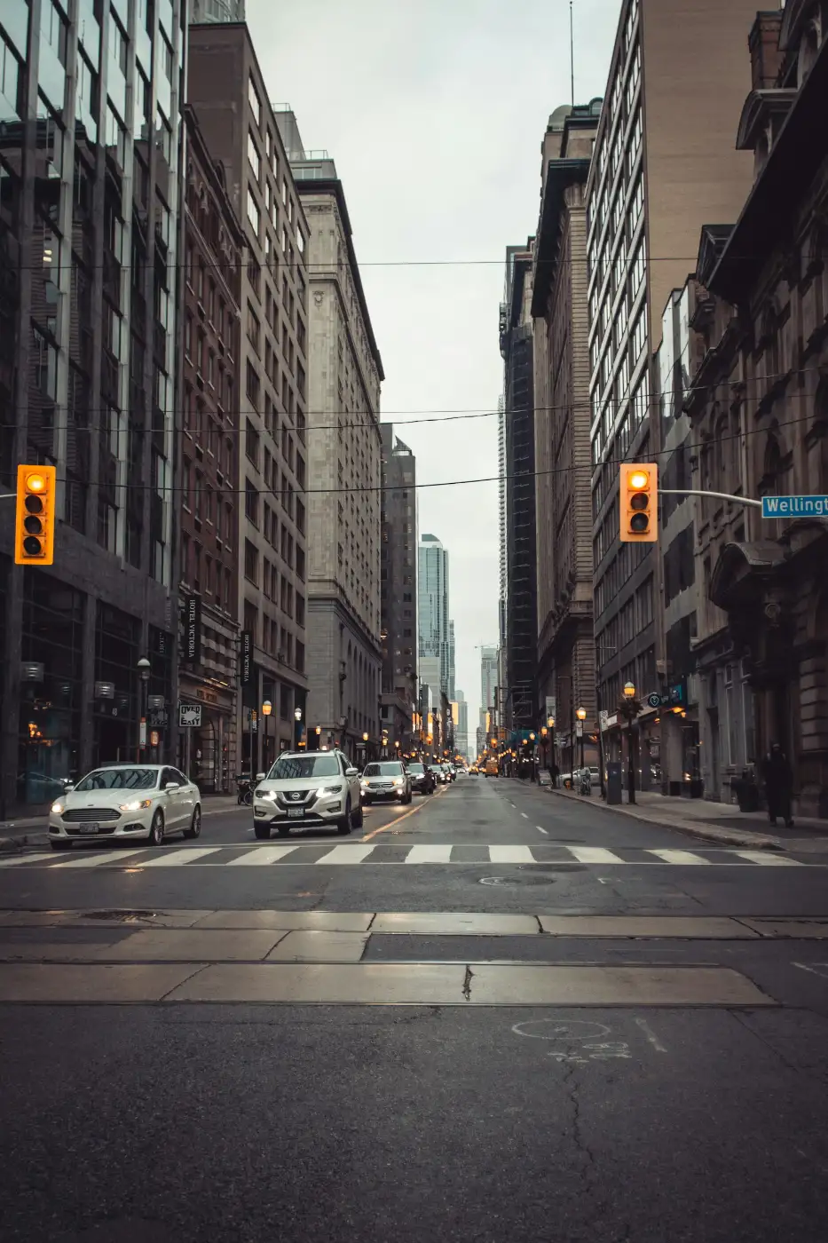 City skyline at dusk with traffic lights, representing daily life while working in Canada