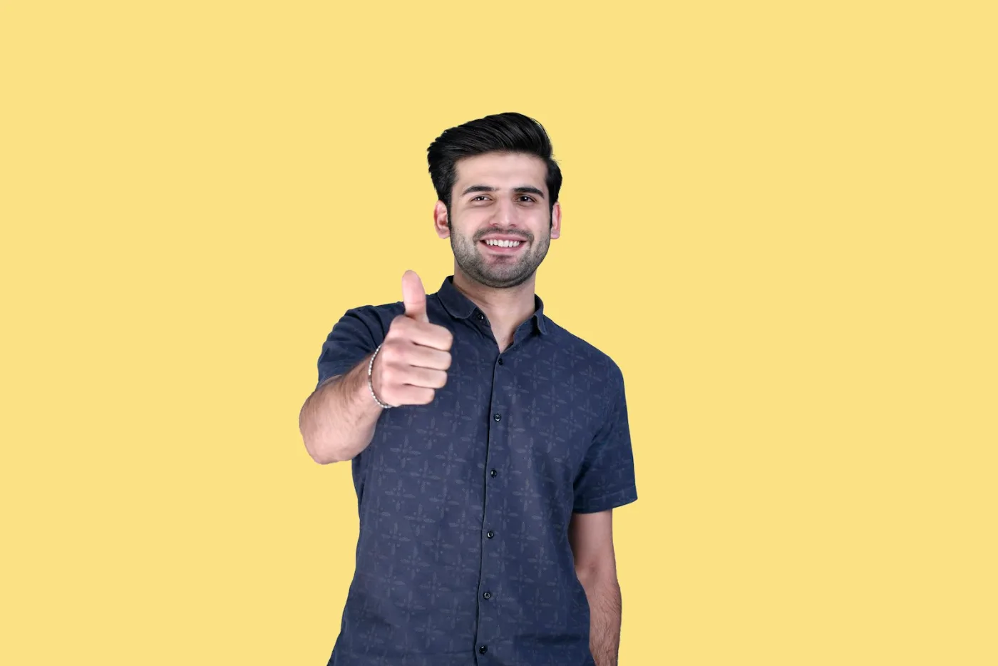 Confident smiling professional giving a thumbs up after achieving a good CRS score