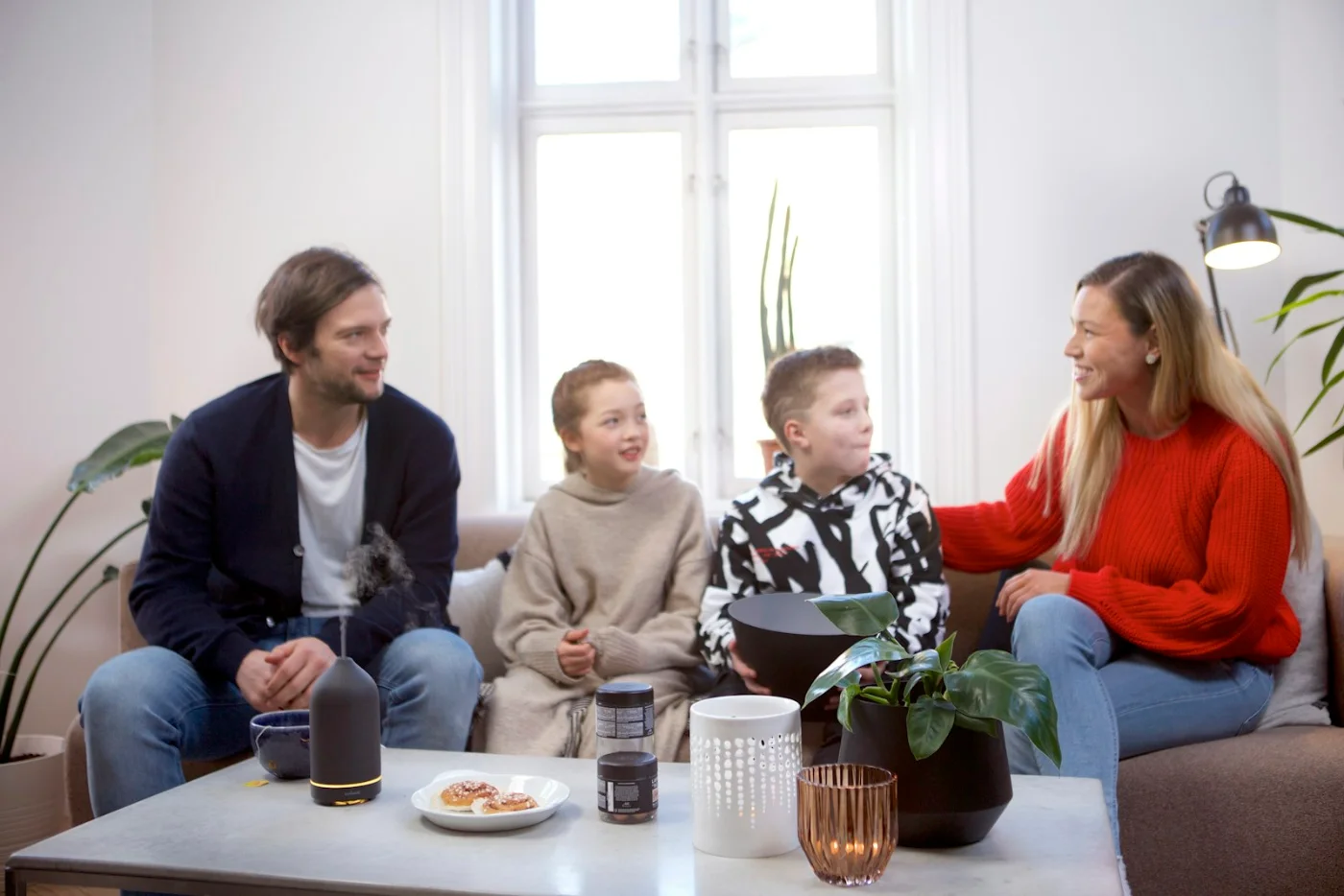 Family sitting together, planning their step-by-step immigration journey to Canada