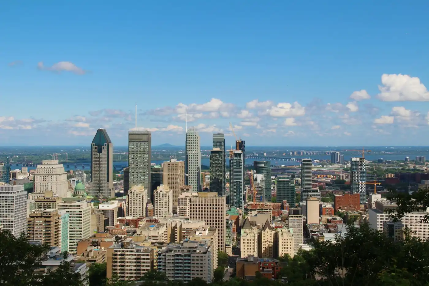 Montreal skyline illuminated at night, a major destination for Quebec immigrants