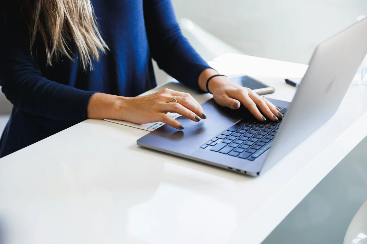 Tech professional working on a laptop, representing H-1B holders transitioning careers to Canada