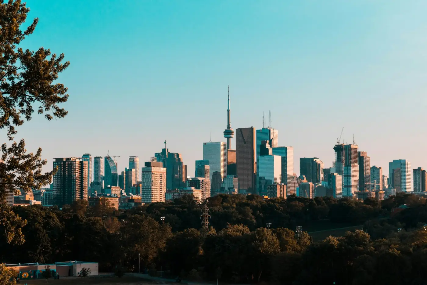 Toronto skyline at dusk, a leading tech hub destination for H-1B workers moving to Canada