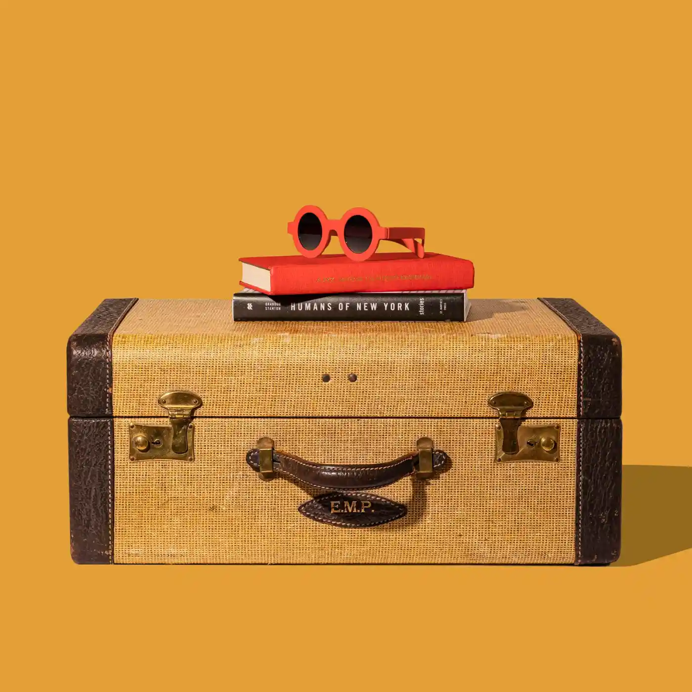 Stack of colourful suitcases, representing time spent traveling outside of Canada