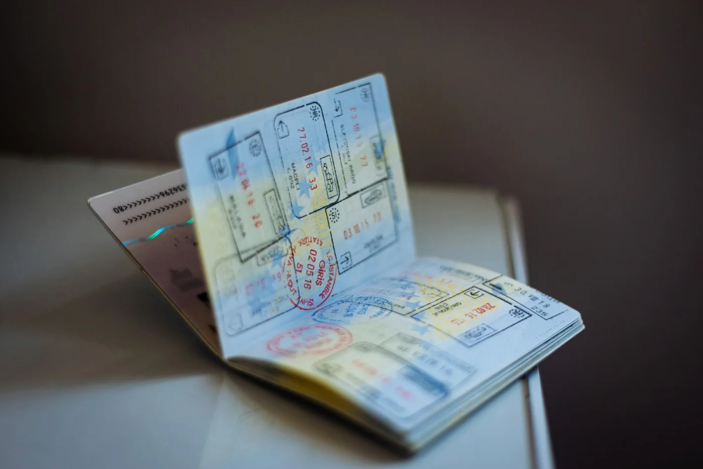 Passport pages filled with visa stamps, representing progress along the TR to PR Canada pathway