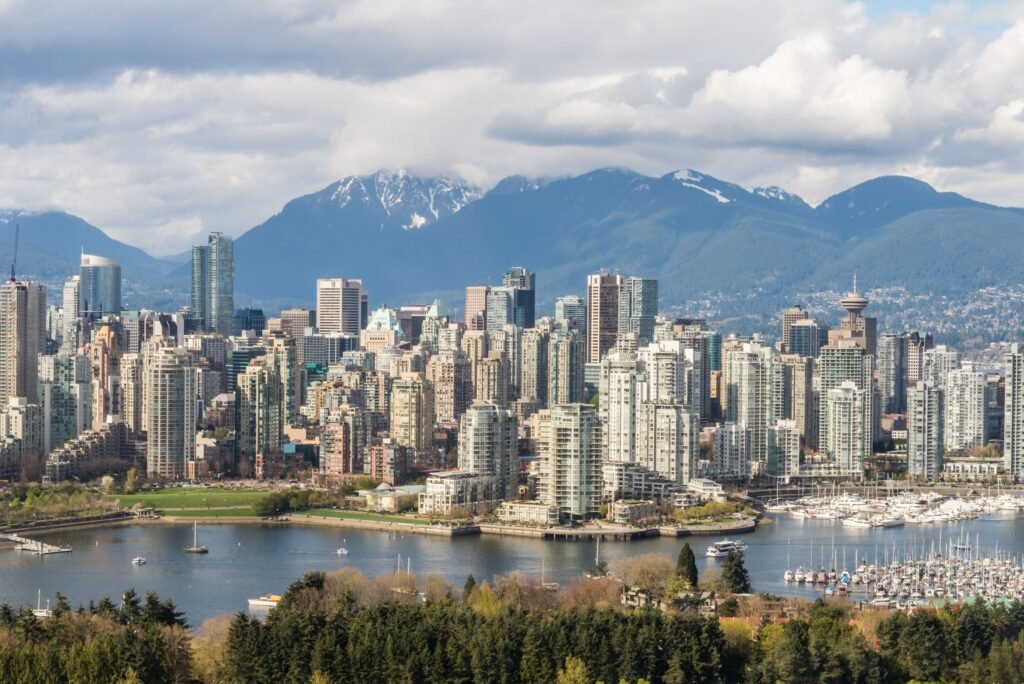 Vancouver skyline and mountains, a top destination for Express Entry Category-Based Draws 2026 healthcare and trade candidates